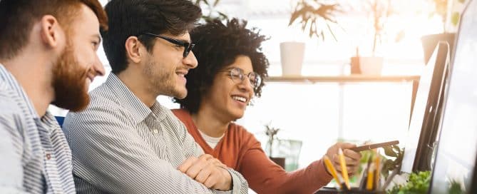 Millennial programmers coding new program on computer at office, empty space